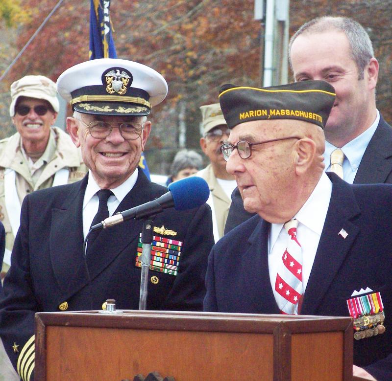 VFW member Joe Napoli, right, introduces retired Navy Captain Robert Ellis during Marion's Veterans Day ceremony. BY MATTHEW BERNAT